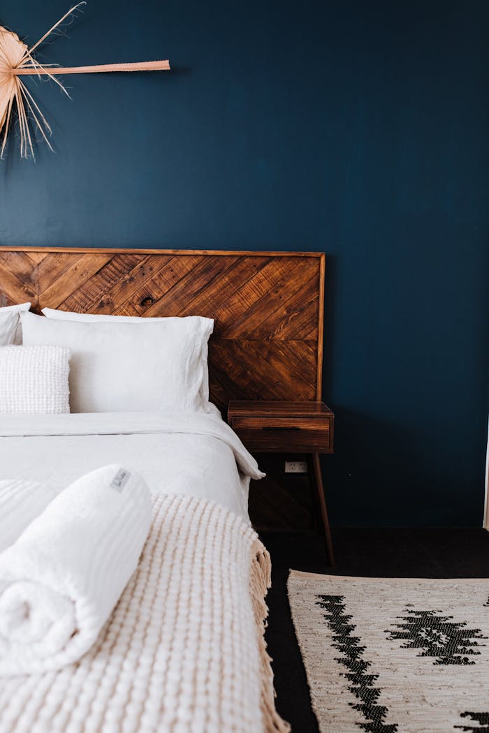 A Bedroom with a Dark Colored Wall